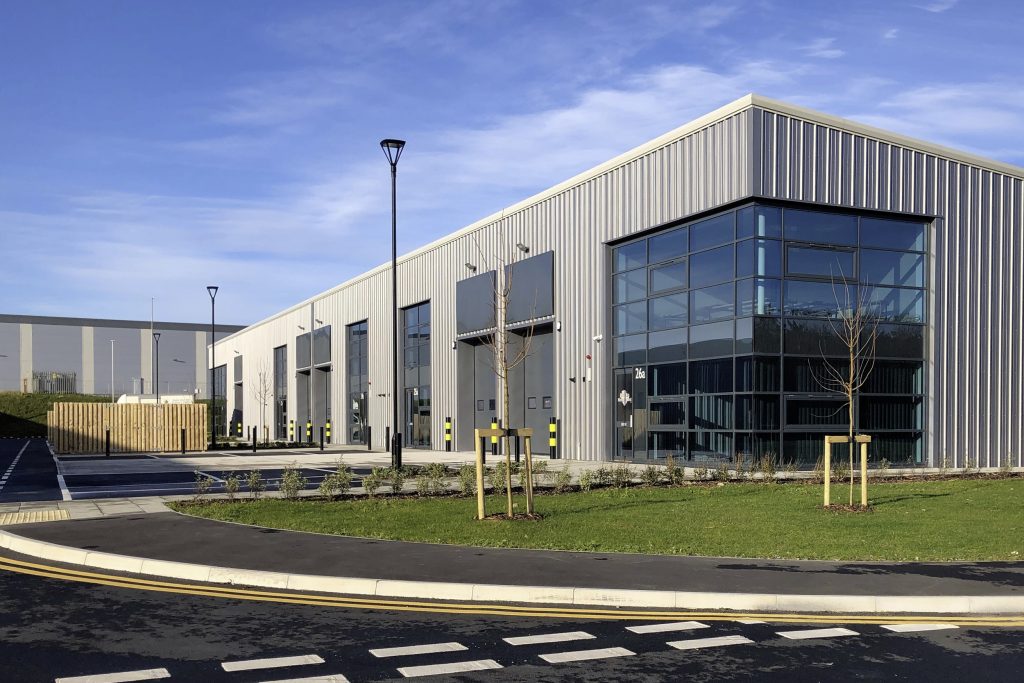 New industrial units with utilities, solar panels, and EV charging for future growth.